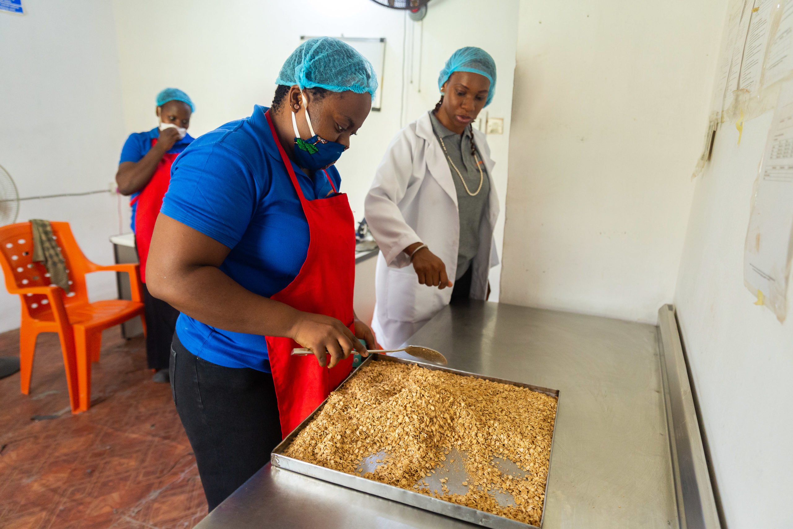 Gloria Ettidinma, a staff member at Nicnax Enterprises, inspects the granola at Nicnax Enterprises in Lagos, Nigeria on 28th January 2021. The Cherie Blair Foundation for Women continues to support women entrepreneurs across many African countries, including Nigeria, through their blended learning programmes, like Road to Growth and HerVenture.