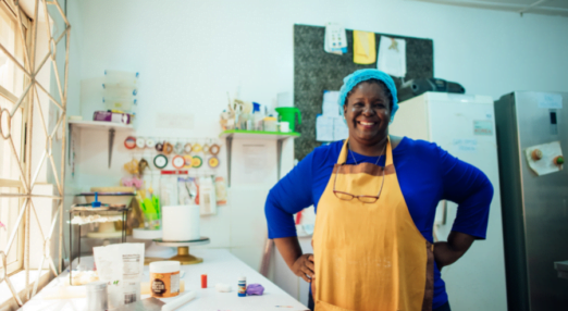 Felicia Ohikere, Founder of Lille's Pastries in Nigeria, Road to Growth alumna smiles in her kitchen