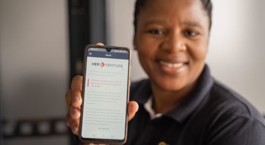 Mampho Sotshongaye, founder and managing director of Golden Rewards 1981, poses for a photograph with the HerVenture App in Cape Town, South Africa, on 28 February 2022. The Cherie Blair Foundation for Women continues to help release the potential of women entrepreneurs in low and middle income countries and close the global gender gap in entrepreneurship.