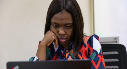 Atinuke Badejo writes down event dates on her laptop at her office in Yaba, Lagos Nigeria on 2nd March 2021. The Cherie Blair Foundation for Women continues to support women entrepreneurs across many African countries through their blended learning programmes, like Road to Growth and HerVenture.