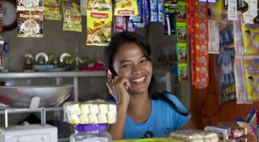 Jula Eha runs a small shop from the front of her house in a quiet residential area near the town of Bogor, Indonesia. Her shop had mixed success at first and she used to become demotivated, but after subscribing to Usaha Wanita she regained her motivation and started to think of more creative ways to make her business a success. As a result her profits have increased and she is now saving money in an education fund for her children. She has also been able to follow Usaha Wanita's advice on savings and investments and she has joined a savings scheme and purchases new fridges and display cabinets for her store.