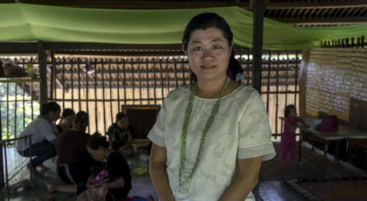 Gina Vun, founder of Exotic Borneo Treasures, poses for a portrait wearing a beaded necklace in the community hall of Tinangol village, in Kudat, Sabah, Malaysia on May 2nd, 2016. Gina is a mentee in the CBF mentorship program, and has been using her online sales business to benefit the Rungus tribal people in continuing their bead-making tradition sustainably. Photo by Suzanne Lee/Panos Pictures for Cherie Blair Foundation