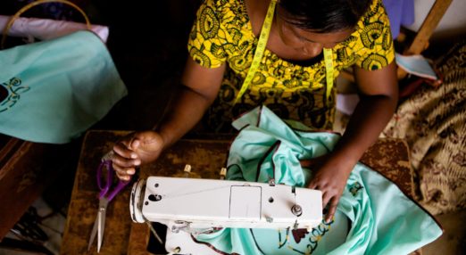Woman entrepreneur uses a sewing machine