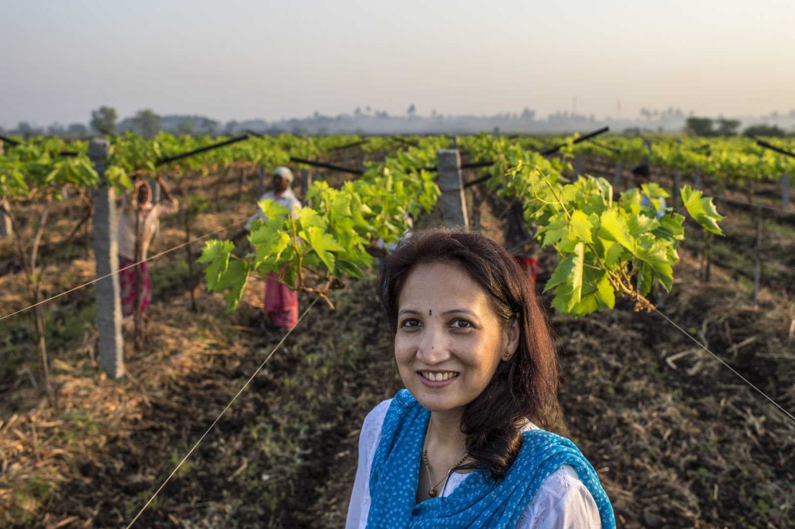 Nina Patil, Director, Fresh Express Logistics, and mentee smiles at her grape farm.