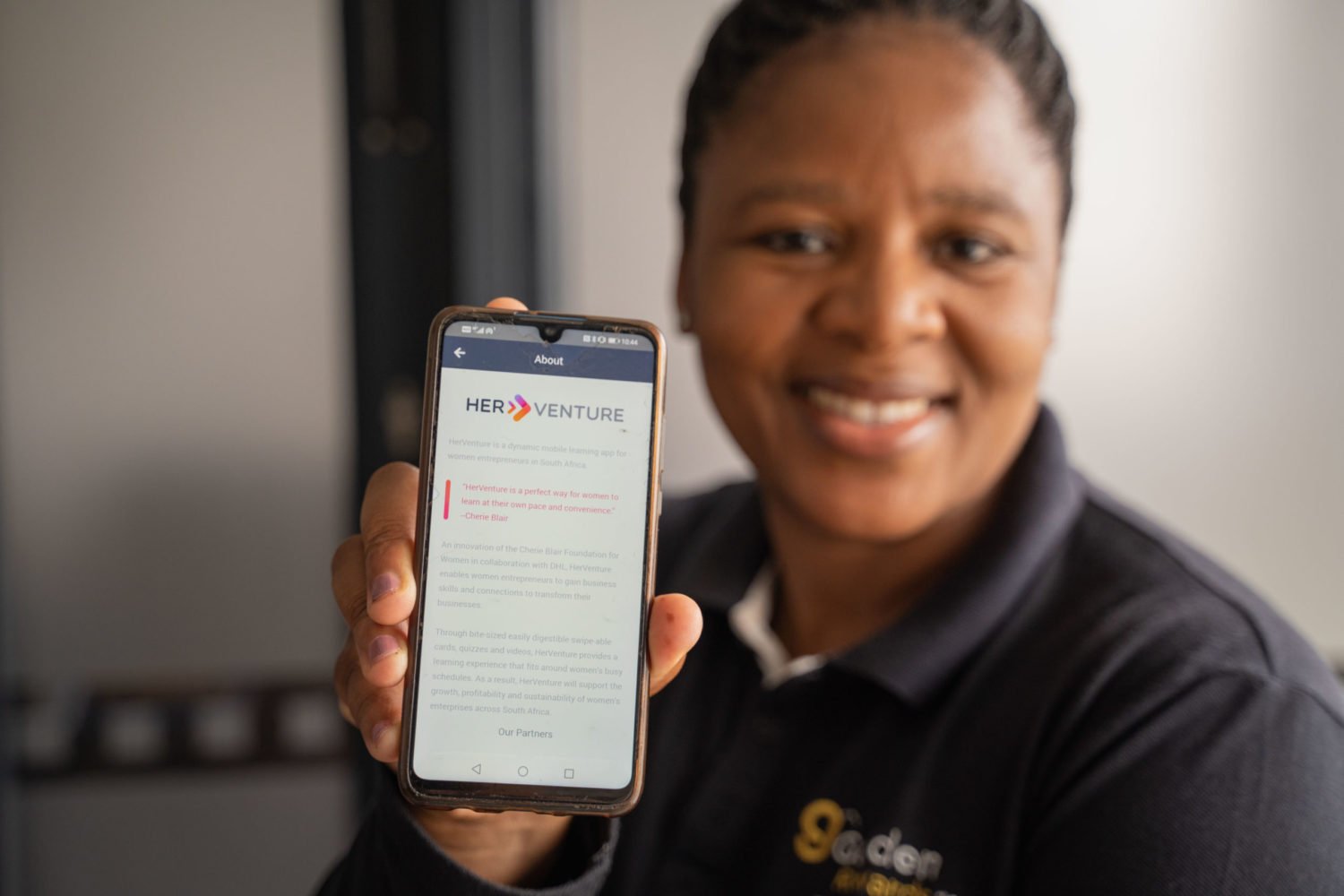 Mampho Sotshongaye, founder and managing director of Golden Rewards 1981, poses for a photograph with the HerVenture App in Cape Town, South Africa, on 28 February 2022. The Cherie Blair Foundation for Women continues to help release the potential of women entrepreneurs in low and middle income countries and close the global gender gap in entrepreneurship.