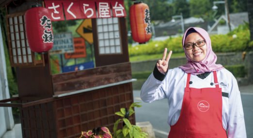 Susi Lawati poses in front of her Japanese restaurant Dapur Sakura