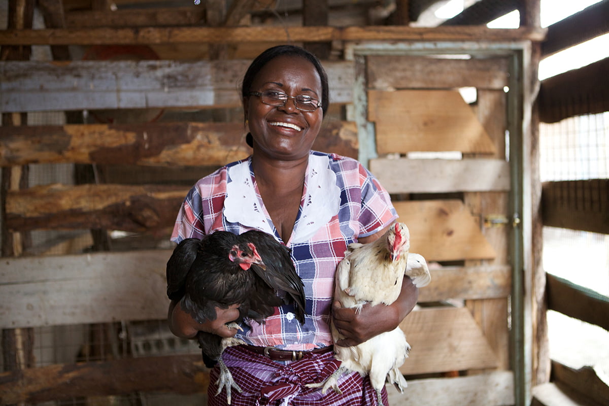 Linna Kinabo pictured with two of her chickens.