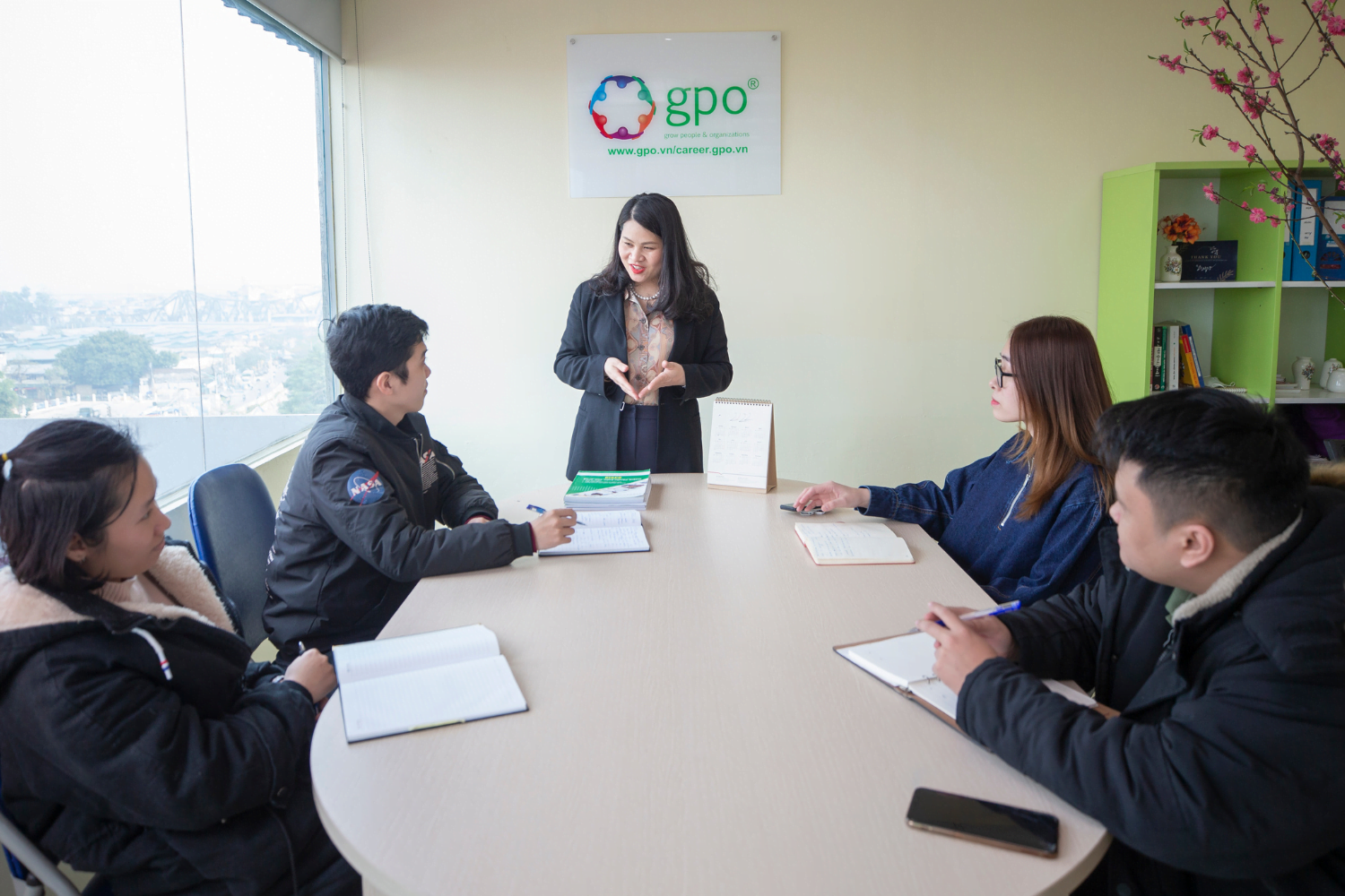 Yen Do leading a meeting at her company in Vietnam
