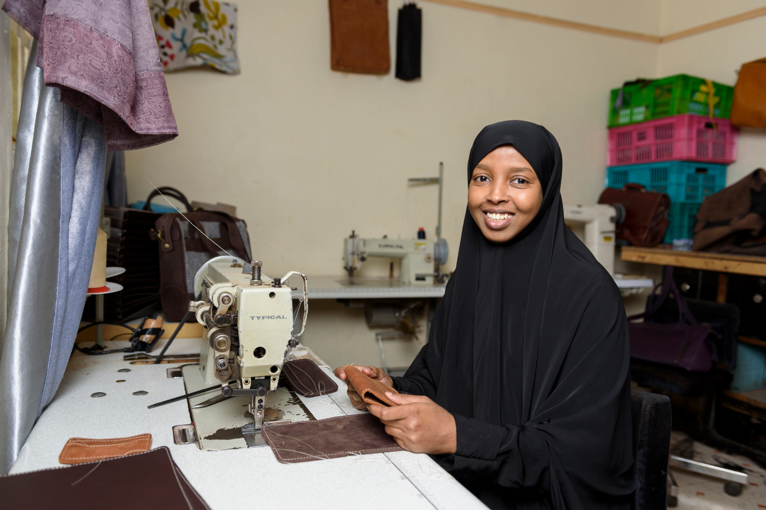 Muna Elmi sews leather products at Mubi Leather in Nairobi