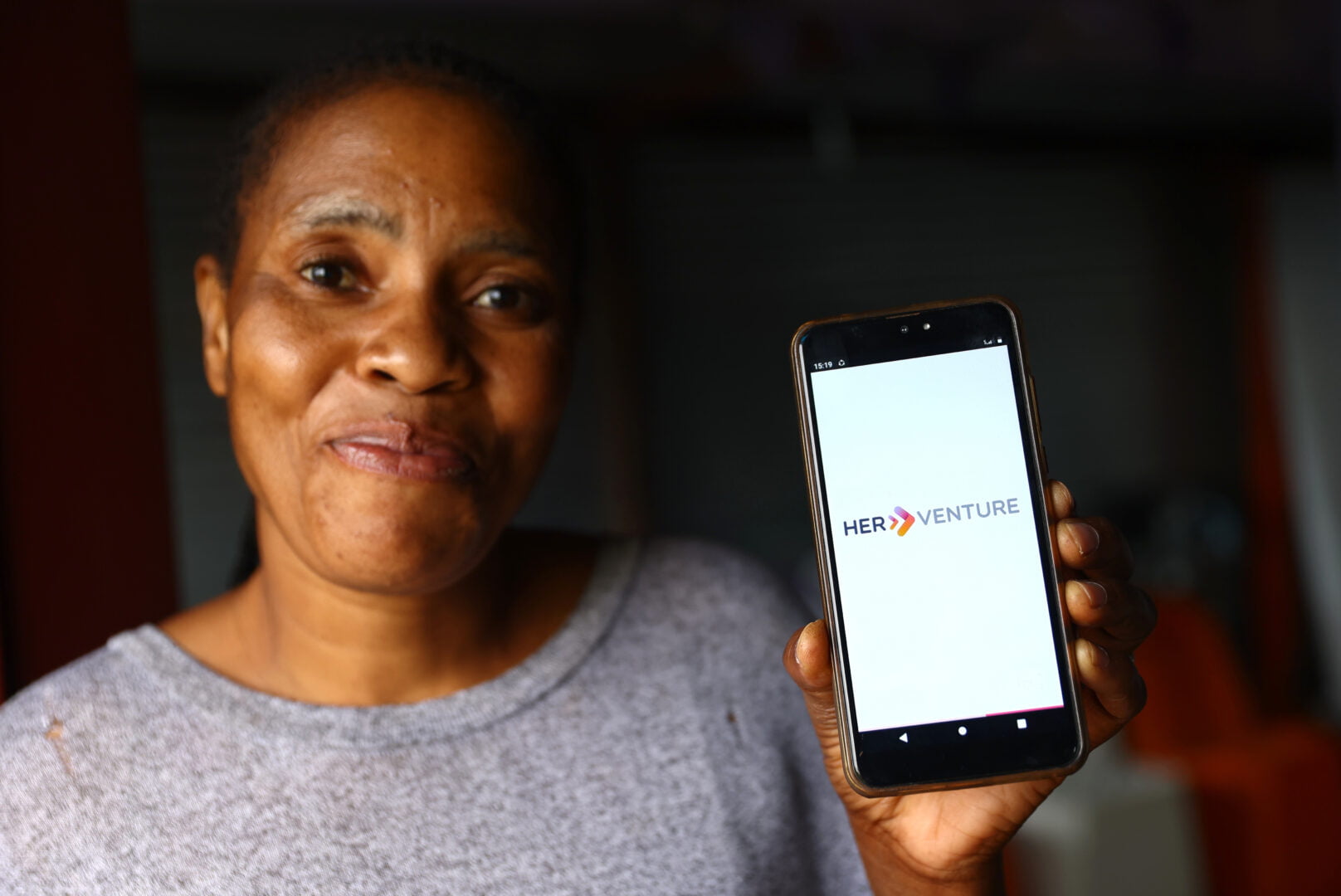 Mercy Manzini, founder of Mercy’s Company, and HerVenture User poses with the app
