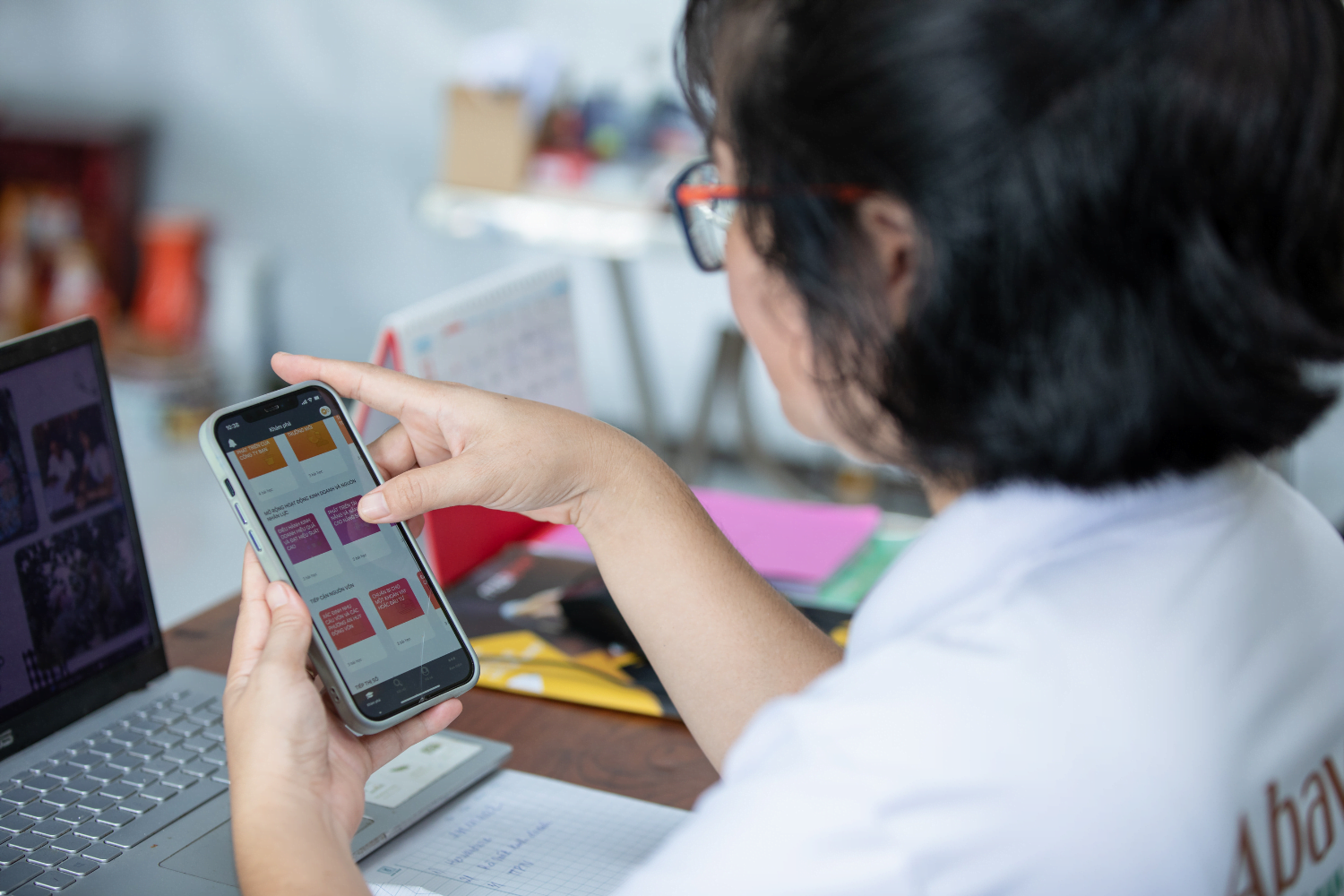 Nguyen Thi Kim Thoa uses the HerVenture app at her business in Vietnam