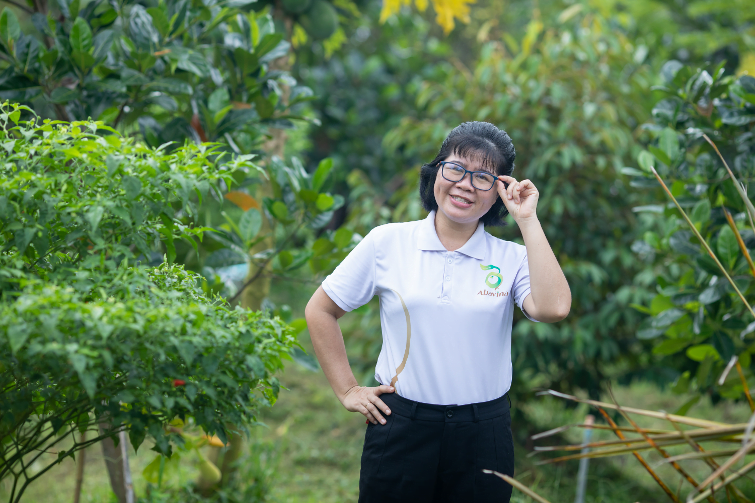 Nguyen Thi Kim Thoa poses on the grounds of her agricultural business in Vietnam