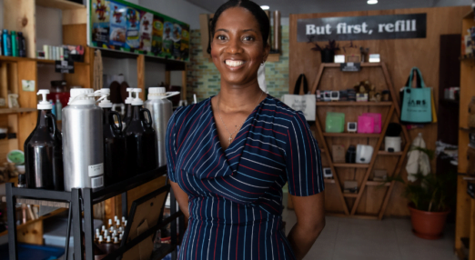 Alana Bunbury-Walton smiles at JARS zero waste store in Guyana