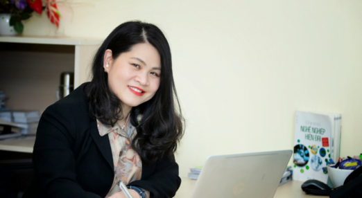 Yen Do, founder of GPO, and WEAVE alumna sits at her computer