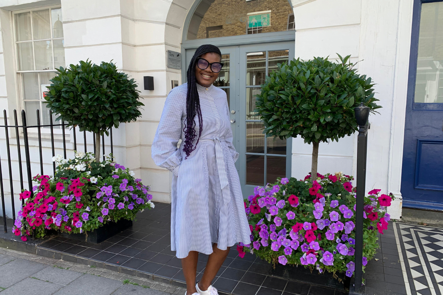 Marcia Skervin, Owner of Connect Your Dots, former mentee poses outside the Cherie Blair Foundation for Women's offices during a visit to London.