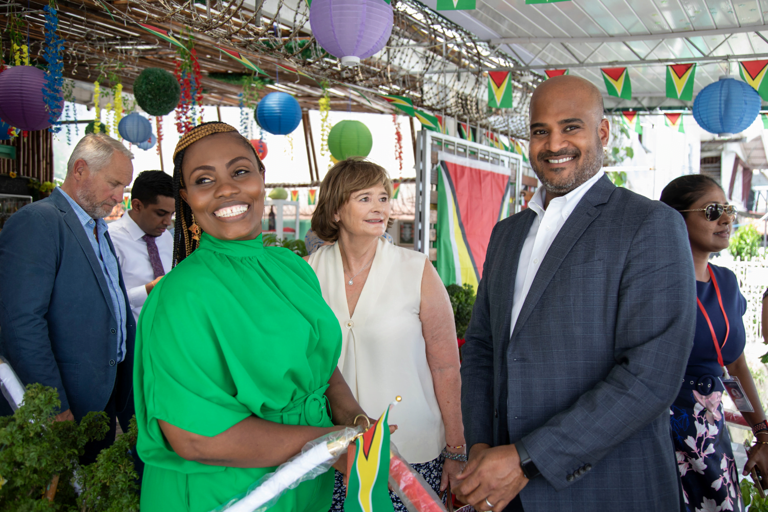 Cherie Blair Foundation and ExxonMobile's are welcomed to the Dionne Graham's (in green), Eco-Garden International, in Georgetown Guyana.