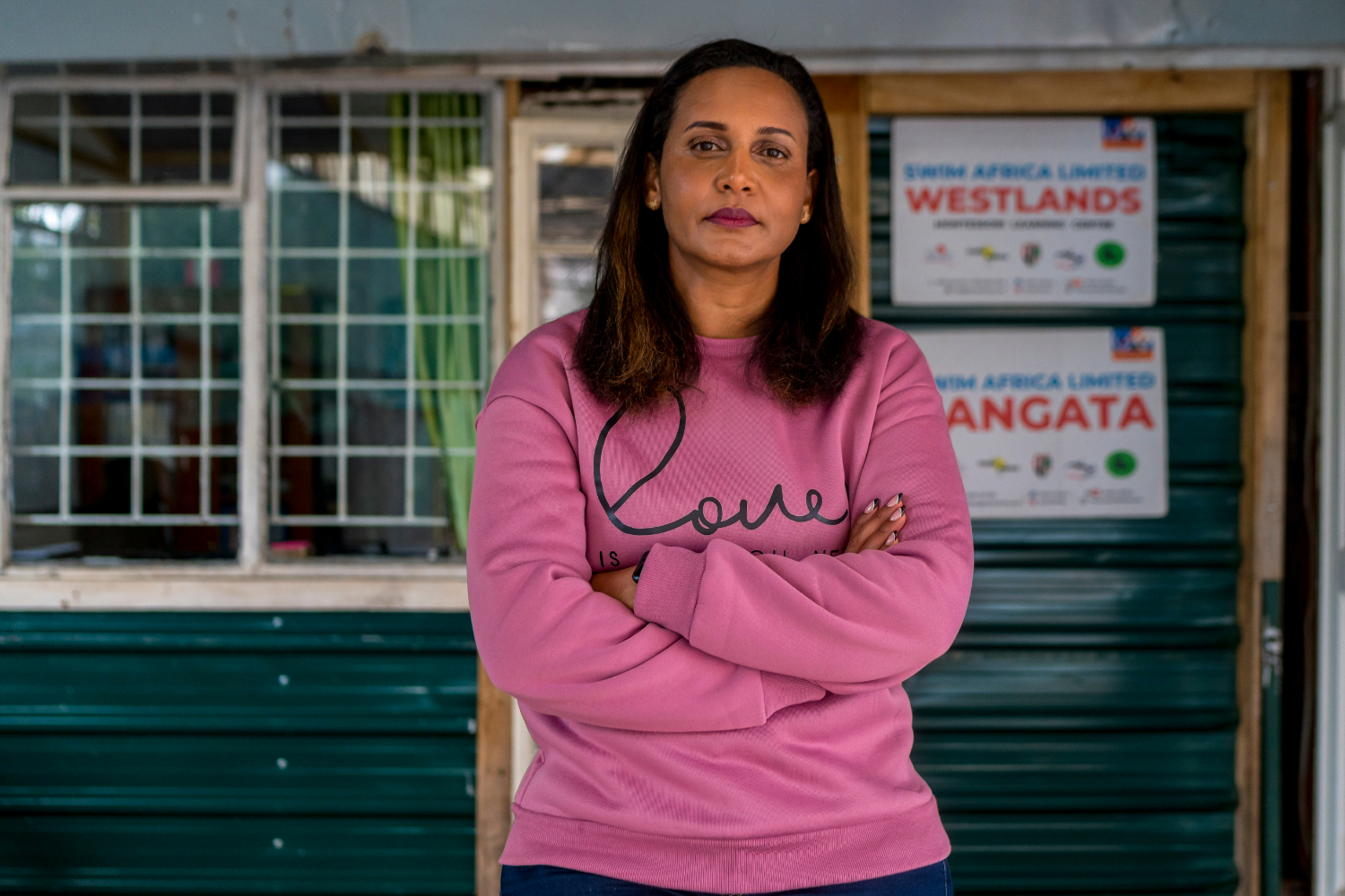 Betty Matharu, Operations Director at Swim Africa, poses in front of her office.