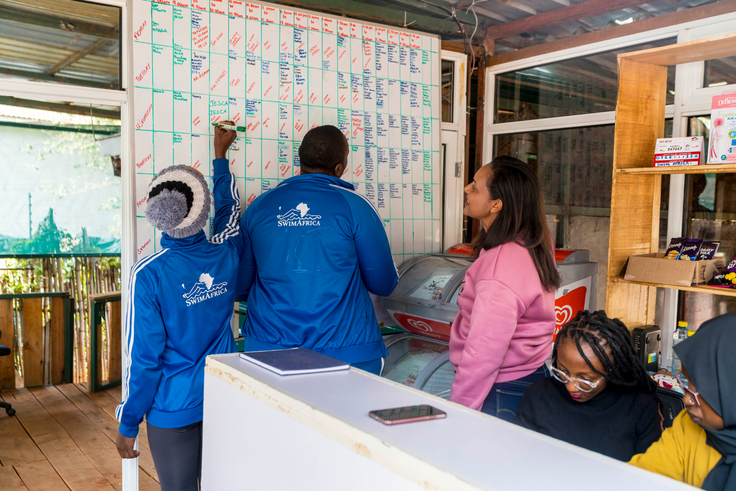 Betty Matharu, Operations Director at Swim Africa, works with her staff.