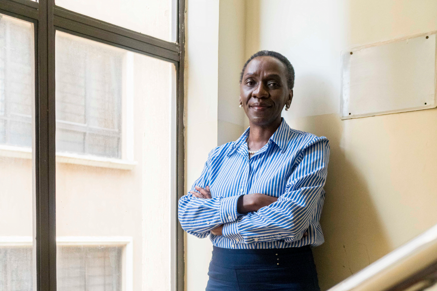 Frida Owinga, Owner of Passion Profit in Nairobi Kenya smiles in her office.