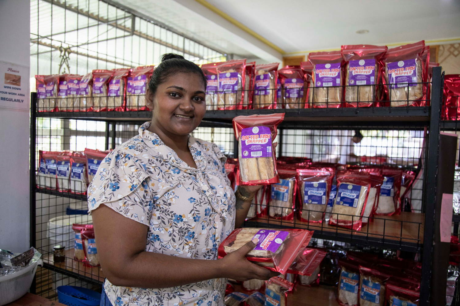 Radhika Basdeo poses with products at Basdeo's Dynasty in Georgetown, Guyana.