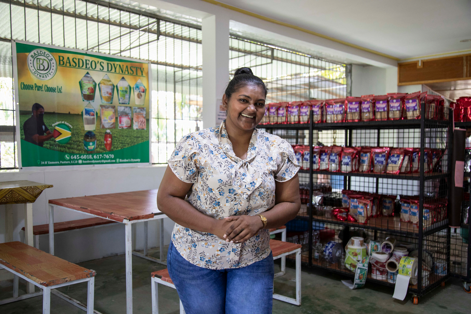 Radhika Basdeo, Sole Proprietress of Basdeo's Dynasty in Guyana smiles in her storefront.