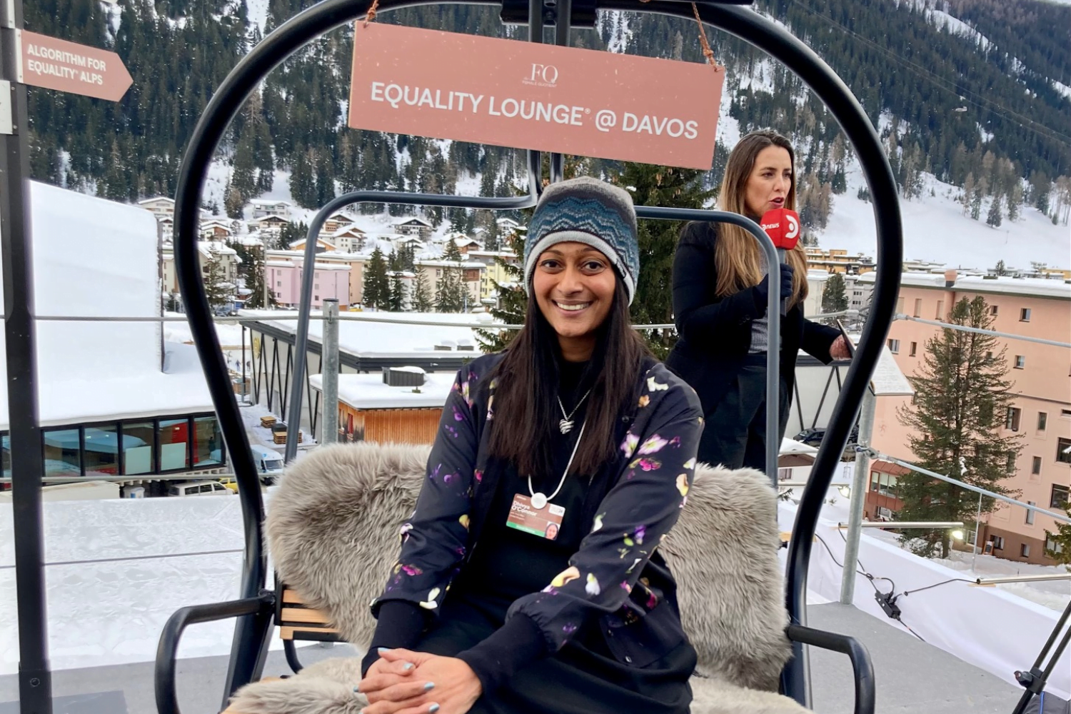 Dhivya O'Connor at Davos with mountains in the background.