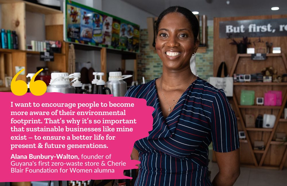 Alana Bunbury-Walton, a Black Guyanese woman with her hair in a low bun, wearing a stripey dress, standing in her zero-waste store smiling at the camera. Text over the top reads "I want to encourage people to become more aware of their environmental footprint. That’s why it’s so important that sustainable businesses like mine exist – to ensure a better life for present & future generations. - Alana Bunbury-Walton, founder of Guyana's first zero-waste store & Cherie Blair Foundation for Women alumna"