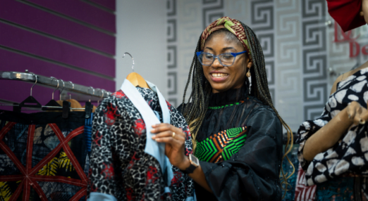 Adaeze Onu, a Nigerian woman entrepreneur and fashion designer works with a garment she designed.